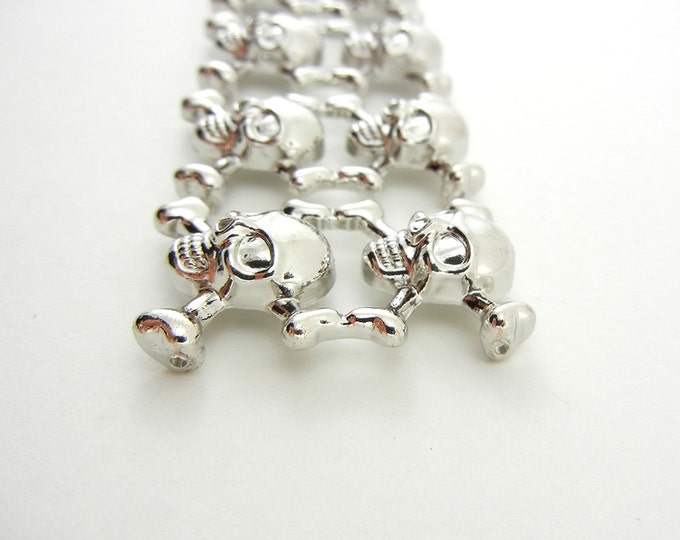 4 Silver-tone Skull and Crossbone Slide Charms