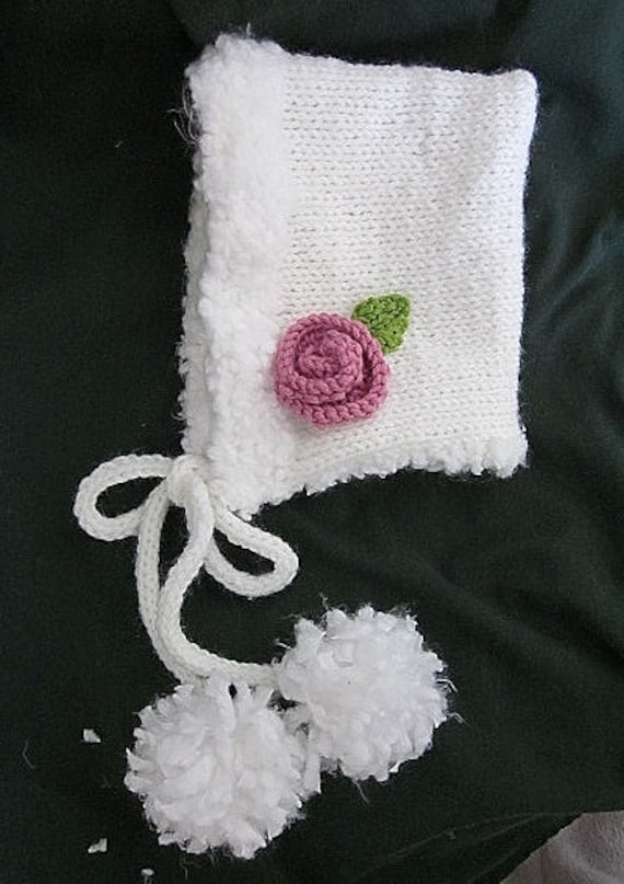 Hand knit white fluffy trim hood style hat with knitted rose