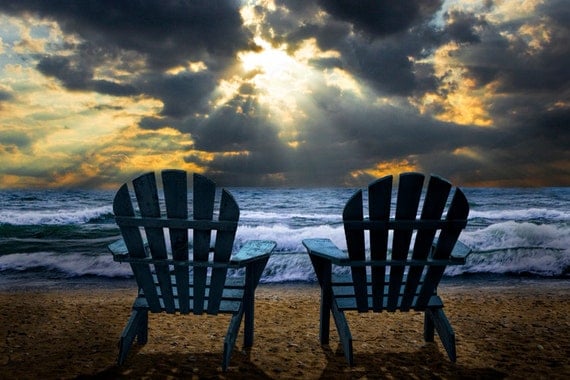 Watching the Sunset of Nature's Splendor with Light Beams bursting through the Clouds on A Lake Michigan Shore A Seascape Nature Photograph