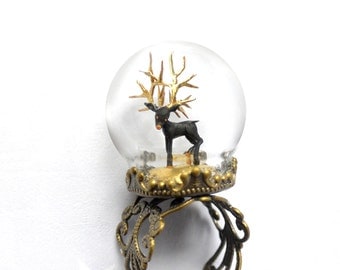 Fantasy Ring globe with Black Deer and gold antlers. Woodland ring