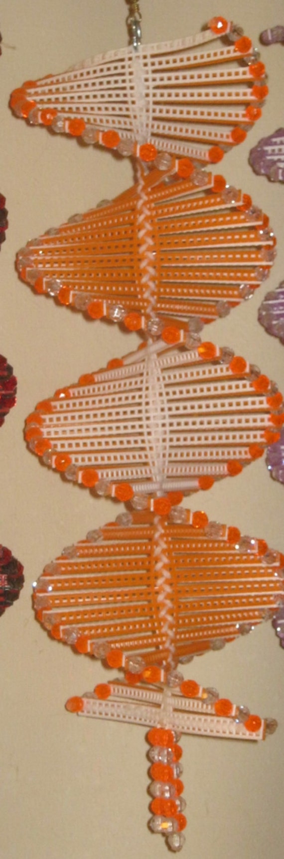 Items similar to Wind Spinner made with plastic canvas and beads on Etsy