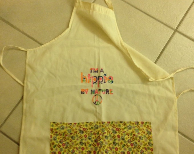 Full Adult Canvas Apron that ties in the back. Two yellow patterned pockets in front, "I'm a Hippie by Nature" painted on front.