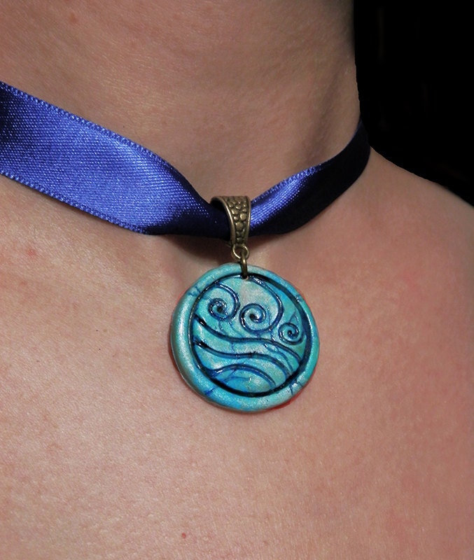 Katara's necklace. Water tribe emblem. Water Tribe 's