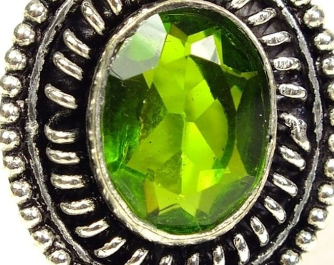 Storewide 25% Off SALE Beautiful Vintage Peridot cocktail ring Featuring multi-faceted peridot green center stone set in white metal