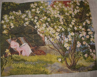 Completed Crossstichwork woman near rosebush Eva Rosenstand