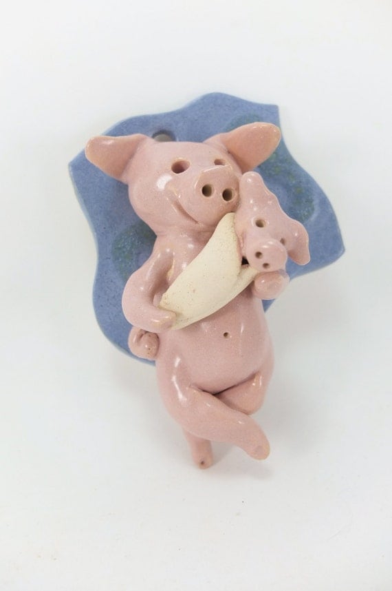 pig in a blanket mother and child wall piece