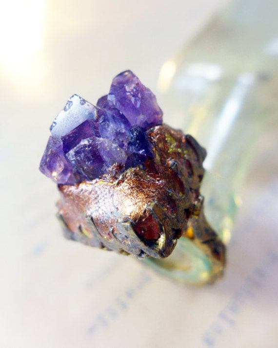 Raw amethyst in deep purple on chunky oxidized ring with coppery gold leaf. Animate.