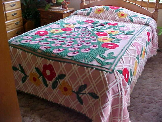 Beautiful peacock chenille bedspread with pink background and