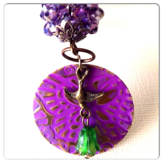 Brass bird on round embossed blanks by TheNatureSoul on Etsy