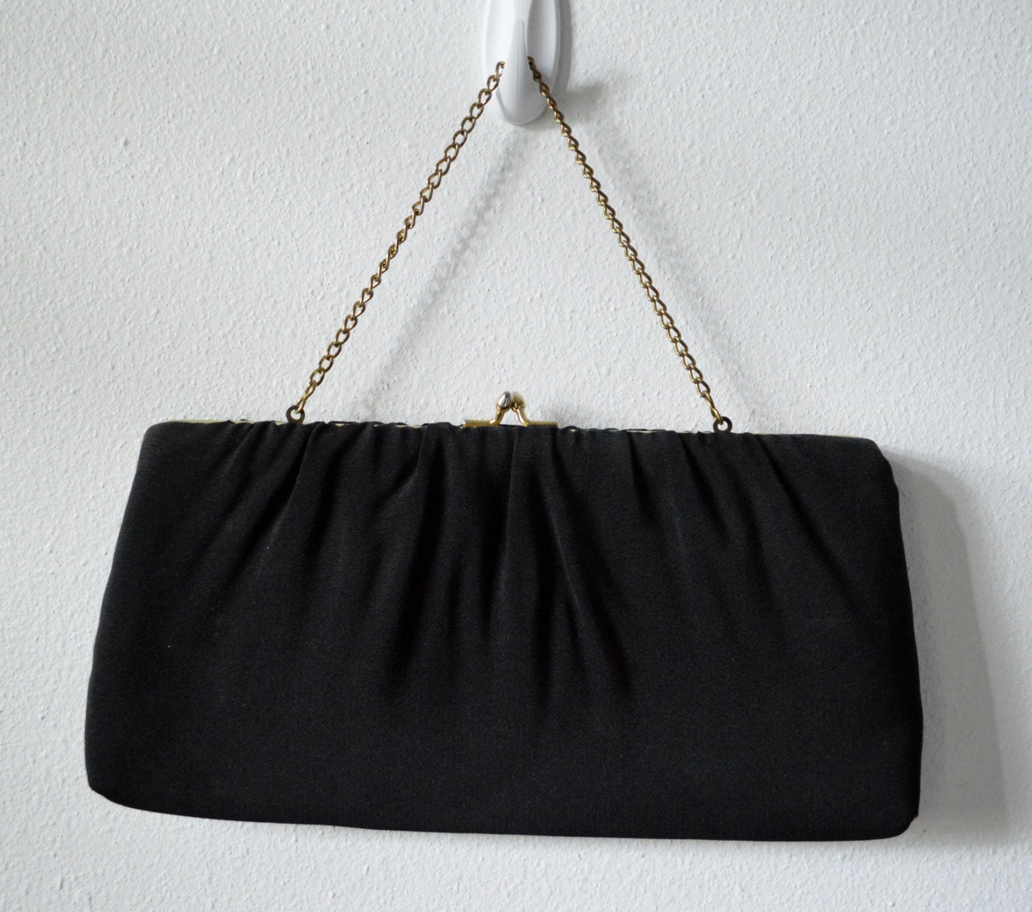 Small black clutch bag Ave Of The Americas Ste, New York · Directions · ()