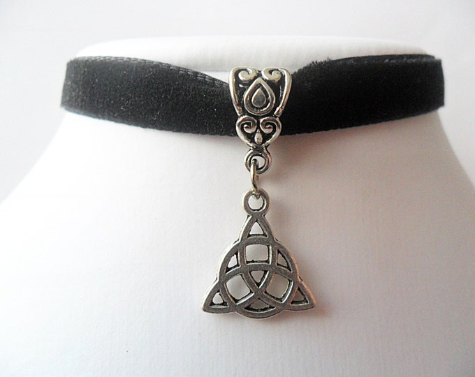 Black velvet choker with triquetra charm with a width of 3/8"inch.