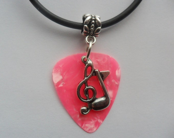 Pink guitar pick necklace with treble clef music note charm that is adjustable from 18" to 20"