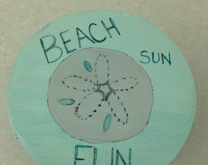 4 1/2" diameter round wood box with lid. Aqua with sand dollar and "Beach, Fun, Sun" on Top