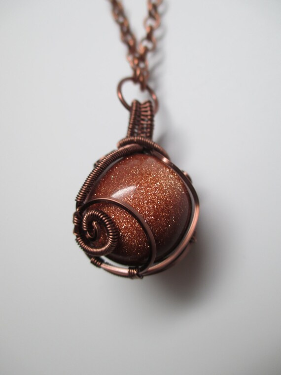 Wire Wrapped Goldstone Orb Necklace in Antique Copper