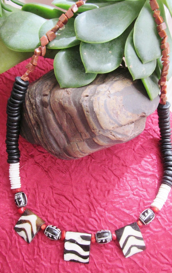 Attractive African style necklace, Zebra pattern on carved horn beads, ostrich shell, wood and gold stone beads