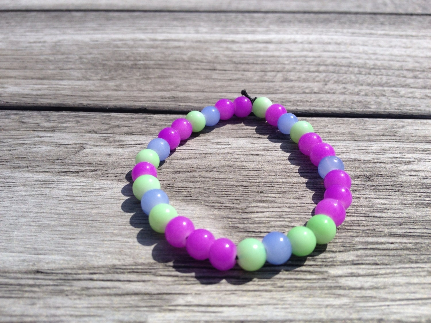 Glass bead bracelet by theGlitterAndGlueCo on Etsy