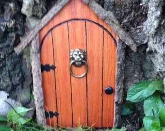 Gnome door, fairy door, or tree door with lion knocker