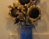 Primitive sunflower and bee bouquet in a mason jar