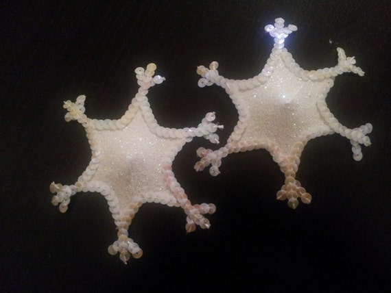 Glitter covered snowflake shaped nipple pasties/ tassels with a sequin border.