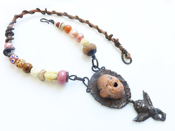 Singing Praise adn Jubilation. Rustic Victorian tribal assemblage necklace in peach pink tan.