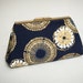 navy blue and gold clutch