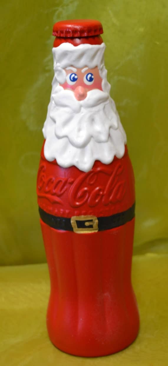 vintage stuffed santa holding coke bottle