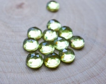 5mm peridot cabochon. Rose cut peridot green gemstone. light green apple green cab faceted green gem