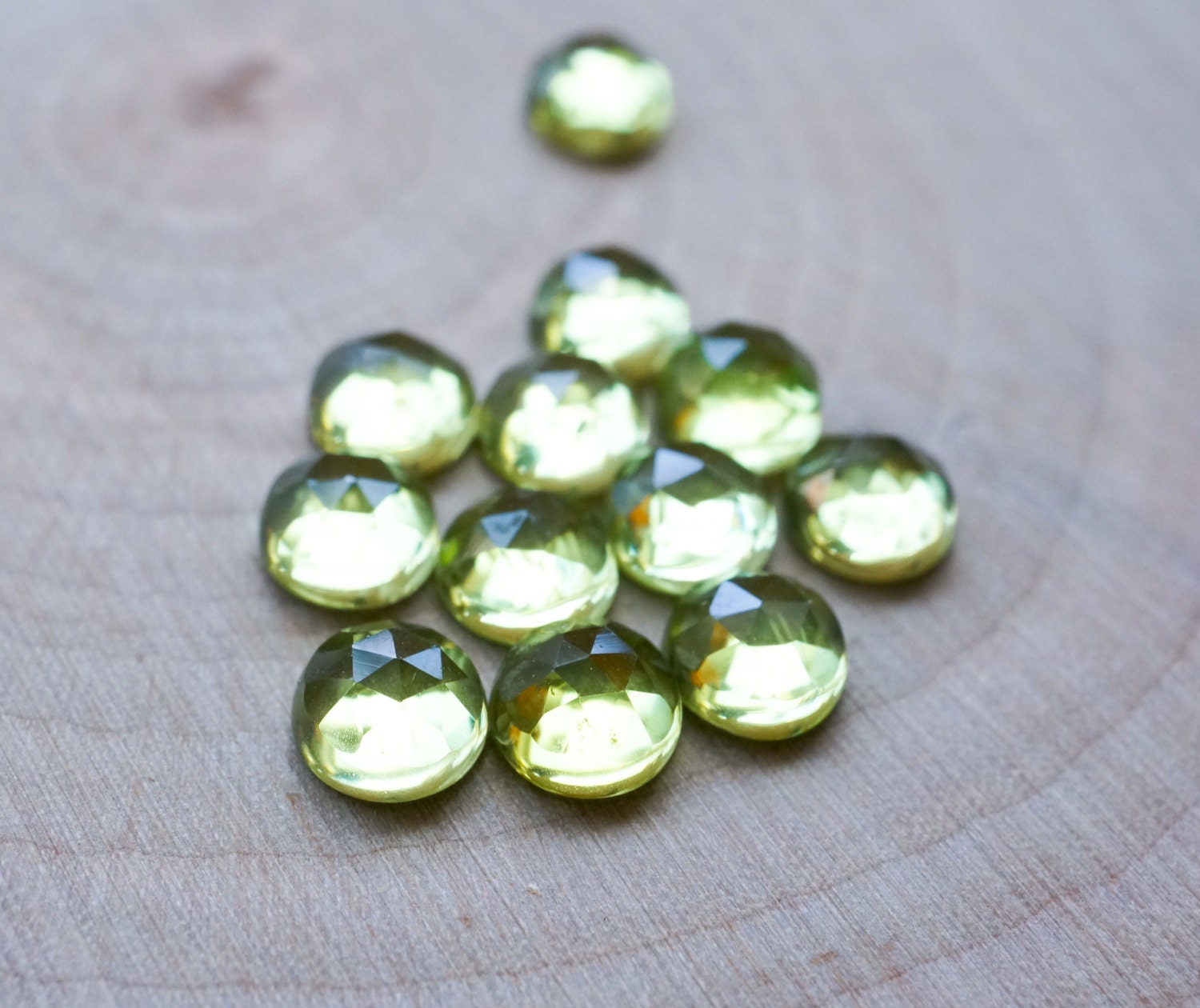 5mm peridot cabochon. Rose cut peridot green gemstone. light