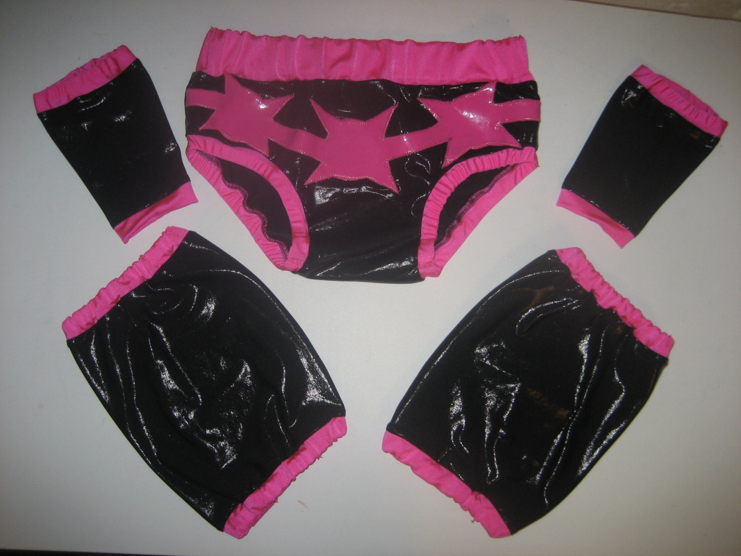 Pro wrestling trunks and set of knee pad & wrist covers with