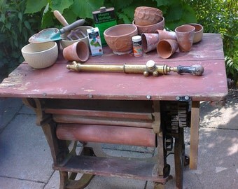 vintage ornamental iron mangle table for garden terracotta post plants. mosley