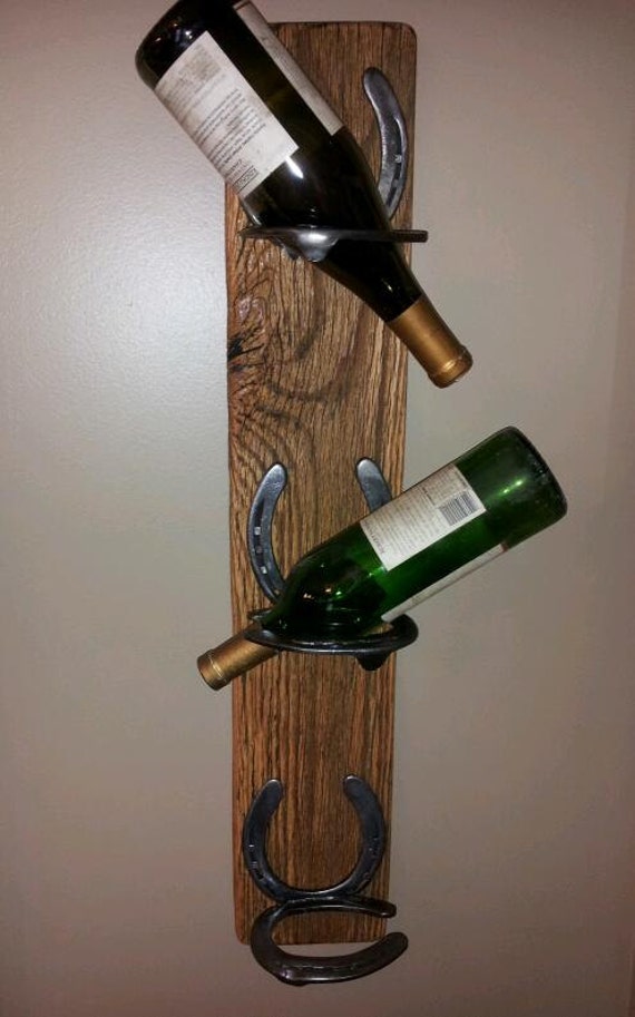 Items similar to Rustic wine rack. made with horse shoes attached to