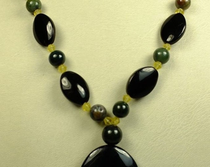 Storewide 25% Off SALE Designer Zumani Smoked Glass tribal pendant with full length necklace of black, green, and yellow beads