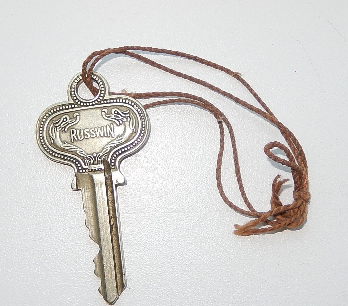 Old KEY Ornate silver tone house key embossed Dragons