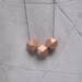geometric necklace with copper faceted wooden beads on a puristic fine ballchain