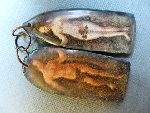 Adam and Eve. Resin shrine charm asymmetrical earring pair.