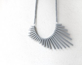 tribal geometric necklace , grey sticks and beads , contemporary jewelry