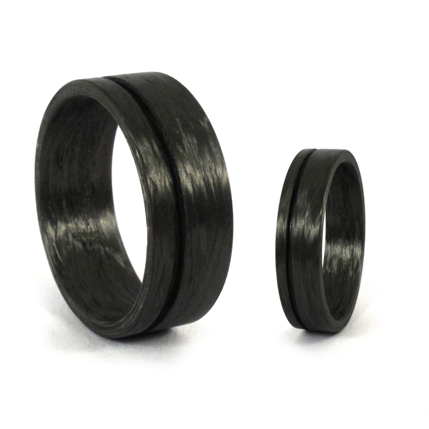 Set of two carbon fiber wedding bands. Unique black wedding