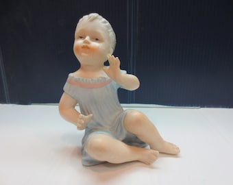 Vintage Bisque Porcelain Piano Baby Figurine