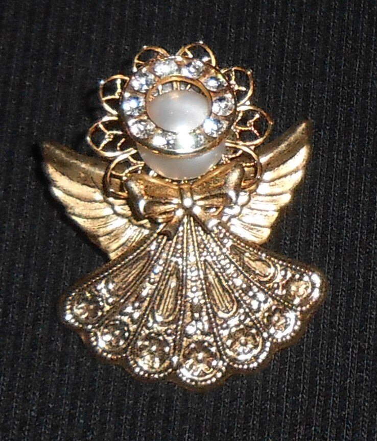 Beautiful gold angel pin with crystal halo.