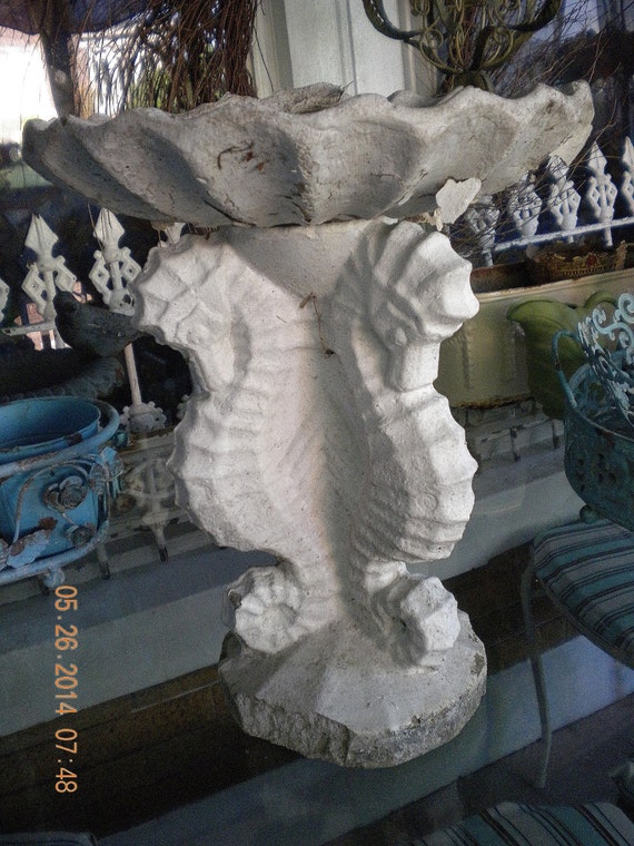 concrete seahorse statue