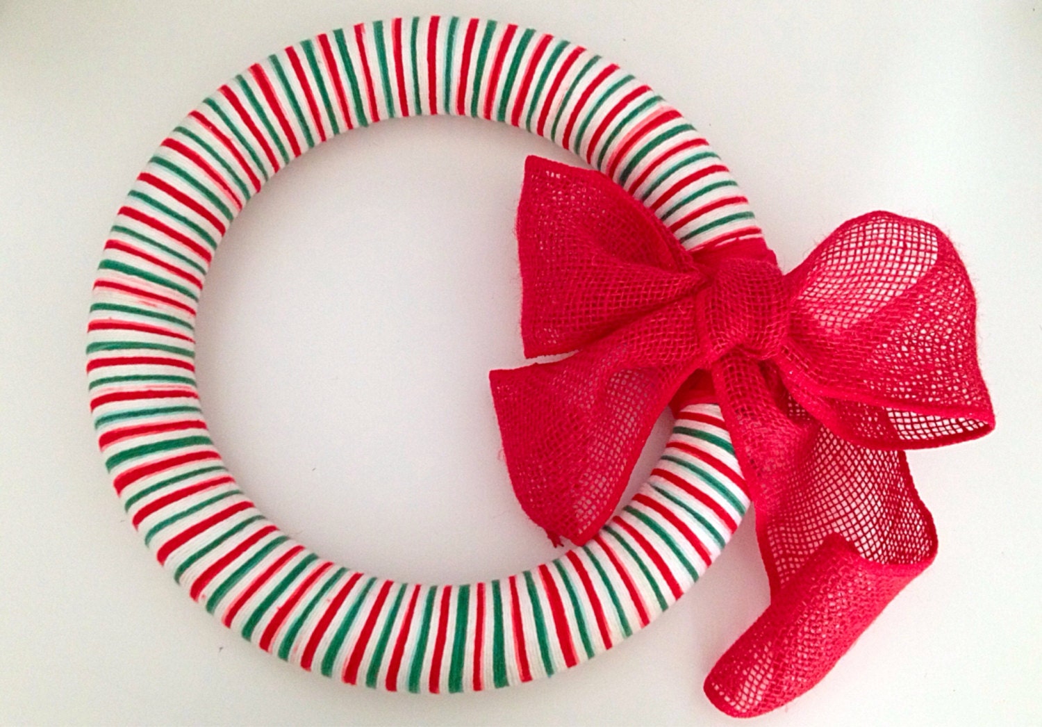 14" yarn wreath, "Candy" is a red, white, and green sweetness. The red burlap is the cherry on top.