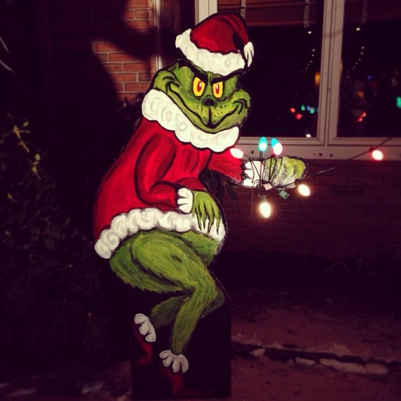 Grinch stealing Christmas decoration lights from by Shanndale
