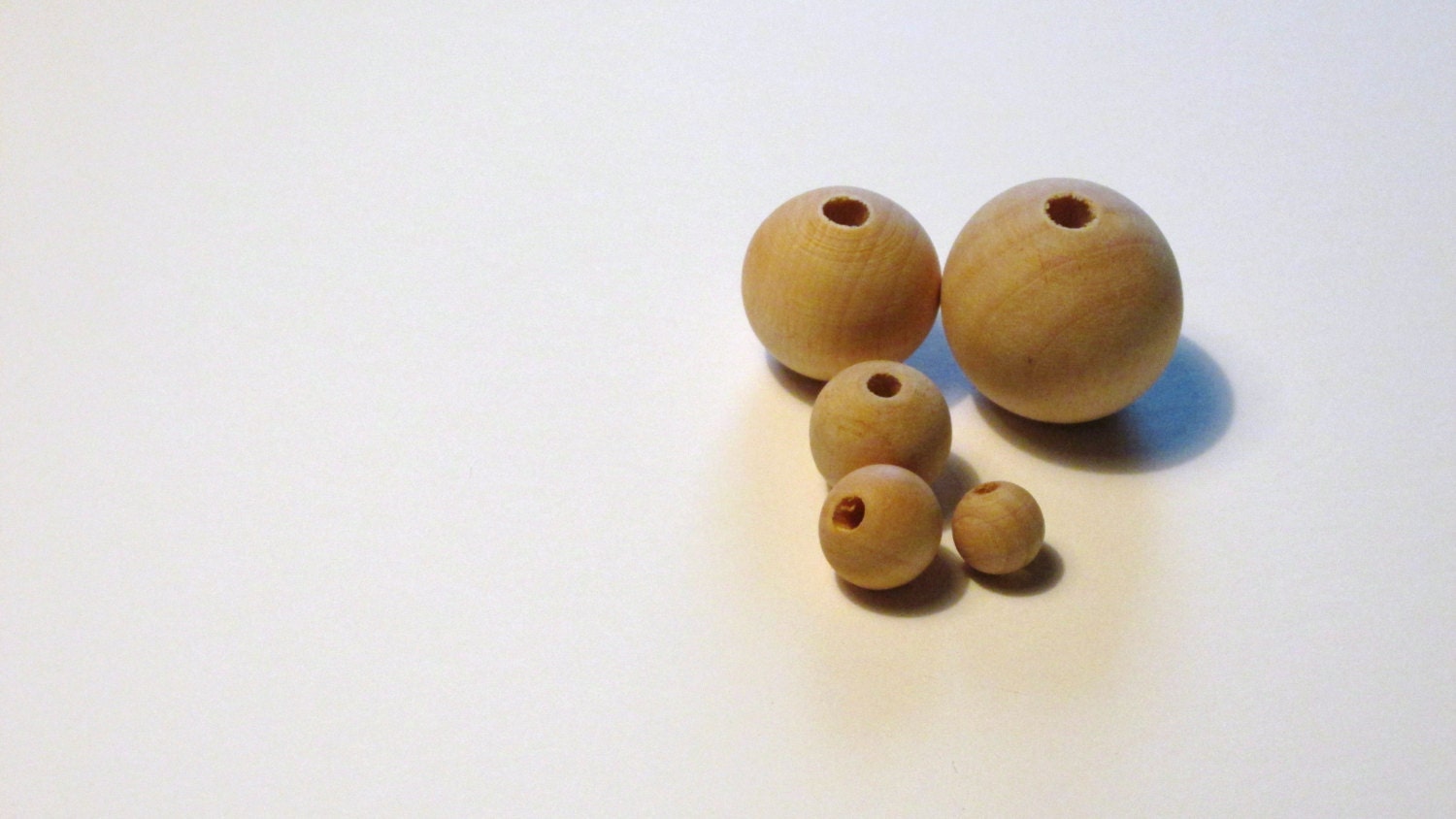 Wholesale Bulk Unfinished Pine Wood Beads by fourlittleladybugs
