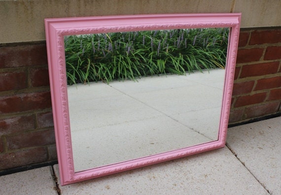 Pink wall mirror with decorative floral frame by BlueWolfHome