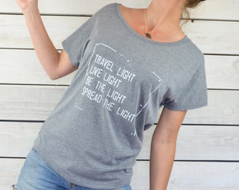 Travel Light, Live Light, Be The Light, Spread The Light. ~ Grey Wide Neck Graphic Tee Shirt