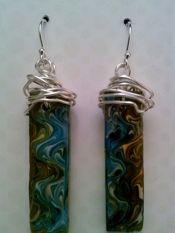 Items similar to Handmade clay beads by Melanie. Earrings are