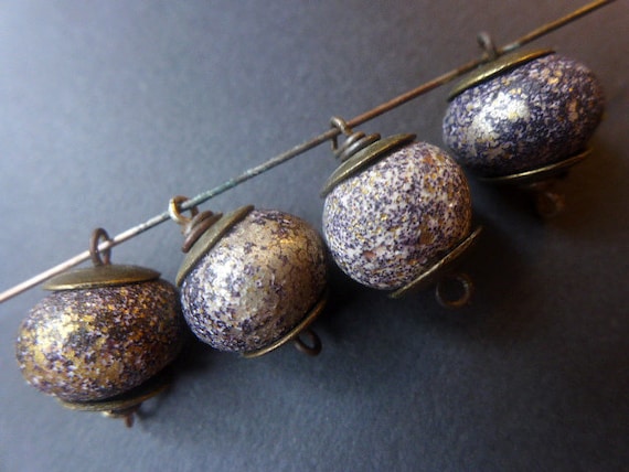 Crusty Glam. 4 dark polymer clay artisan bead links with gold and black speckles and antiqued bronze caps.