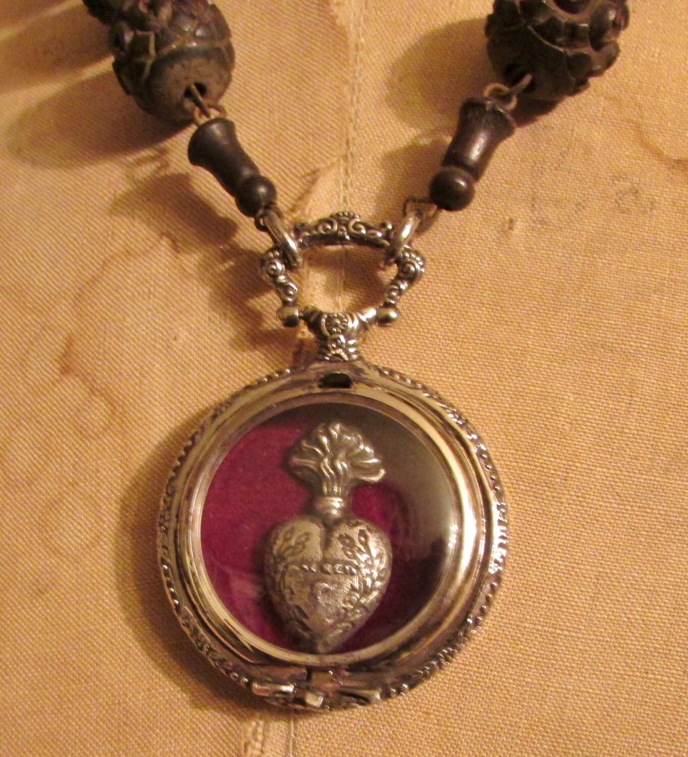 Sacred heart reliquary necklace engraved watch case antique
