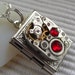 Steampunk book locket necklace - with vintage watch movement and Ruby Red Swarovski crystals