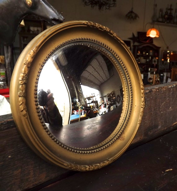 antique round convex wall mirror